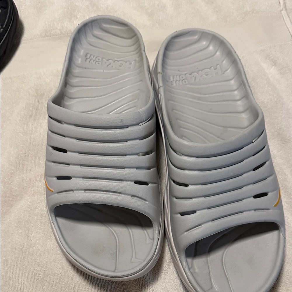 Hoka Light Gray Slip-On Slide Sandals with Small Yellow Accent